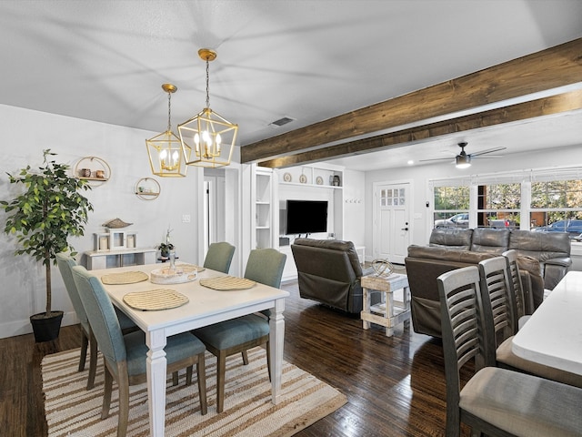 dining area with dark hardwood / wood-style flooring, ceiling fan with notable chandelier, and beamed ceiling