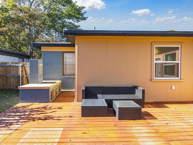 wooden terrace with outdoor lounge area