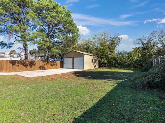 view of yard with a garage and an outdoor structure