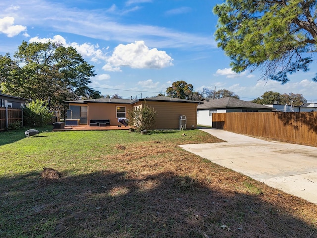 view of yard featuring a wooden deck and a patio area