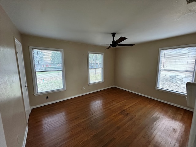 unfurnished room featuring ceiling fan and dark hardwood / wood-style flooring