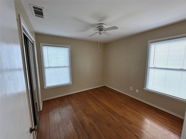 empty room with wood-type flooring and ceiling fan