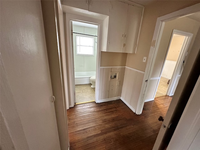 corridor featuring dark hardwood / wood-style floors