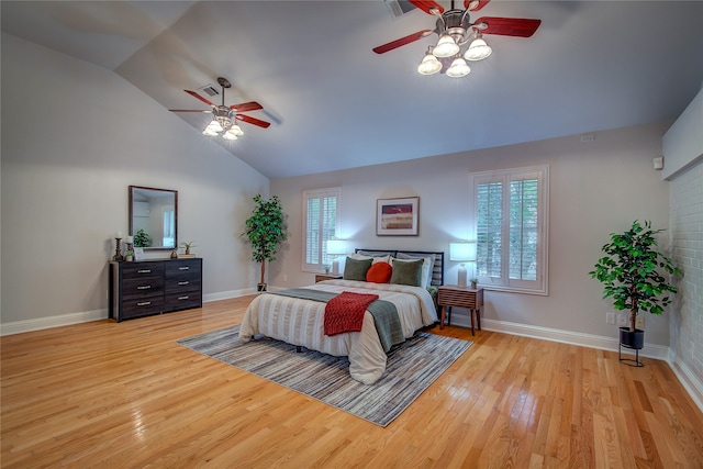 bedroom featuring light hardwood / wood-style flooring, ceiling fan, and lofted ceiling