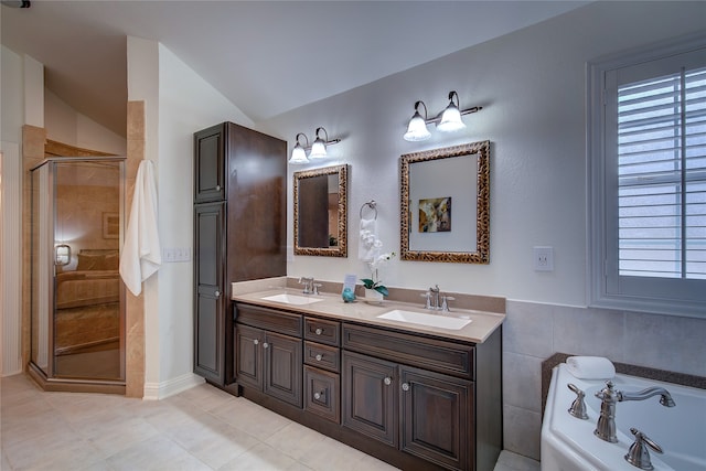 bathroom with walk in shower, vanity, a wealth of natural light, and lofted ceiling