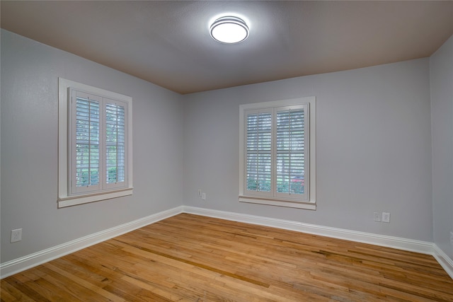 spare room with a healthy amount of sunlight and light wood-type flooring