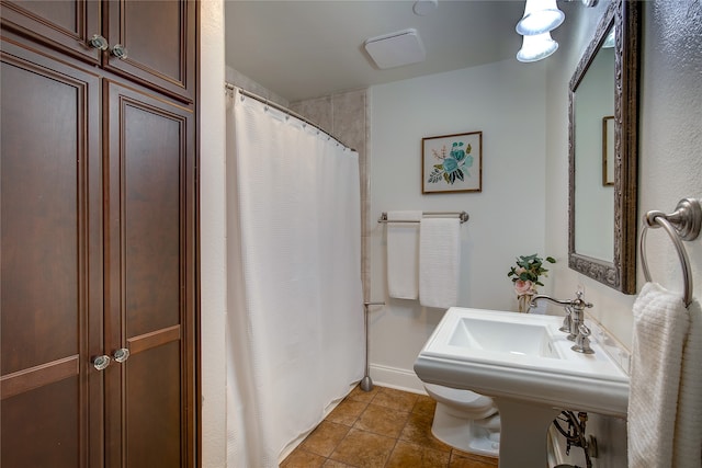 bathroom with tile patterned floors