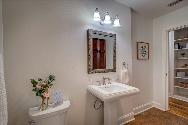 bathroom with sink, tile patterned flooring, and toilet