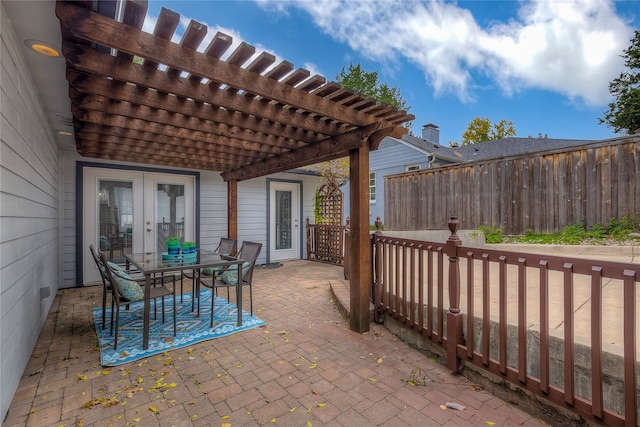 view of patio with french doors and a pergola