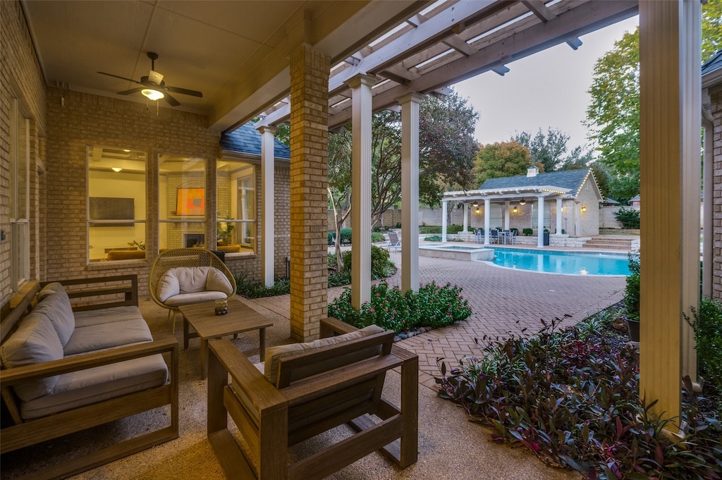 exterior space with a swimming pool with hot tub and a pergola