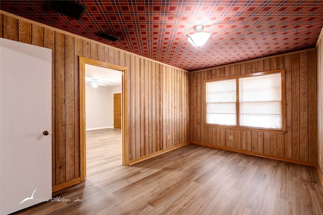 spare room with hardwood / wood-style flooring