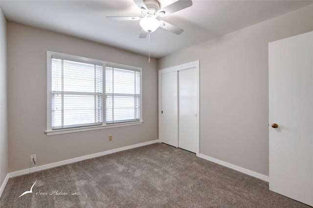 unfurnished bedroom featuring carpet flooring, ceiling fan, and a closet