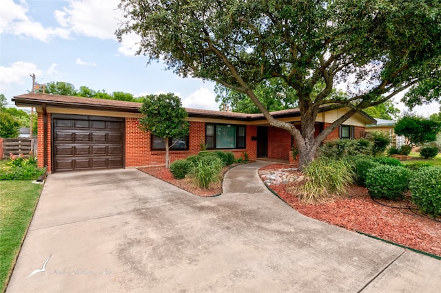 single story home featuring a garage