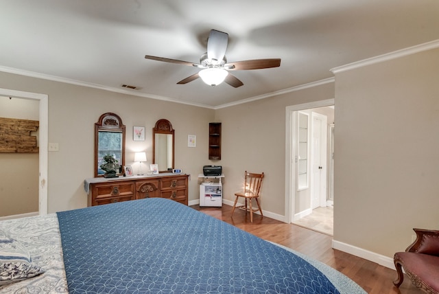 bedroom featuring ceiling fan, ornamental molding, connected bathroom, and hardwood / wood-style floors