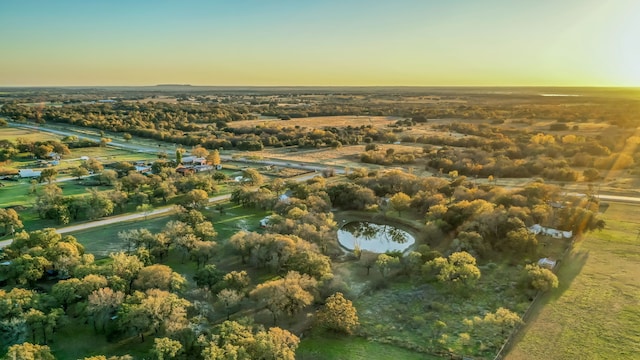 aerial view at dusk with a water view