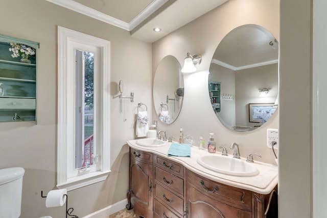 bathroom with vanity, toilet, and ornamental molding