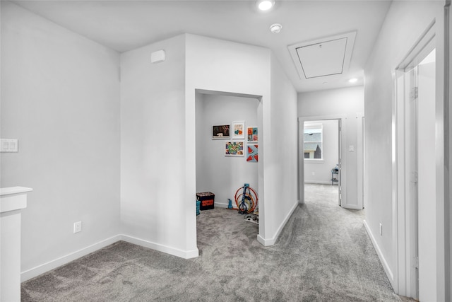 corridor with light colored carpet