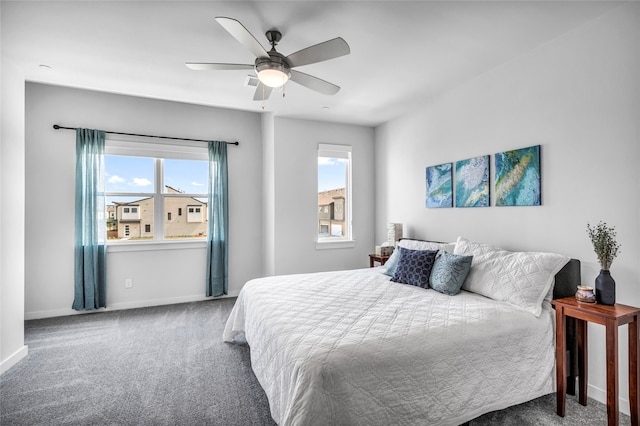 bedroom with ceiling fan and carpet floors