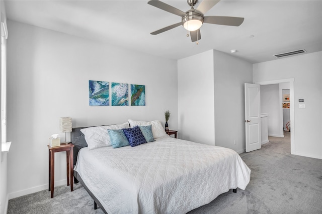 bedroom with light colored carpet and ceiling fan