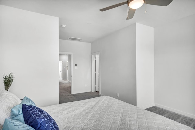 bedroom with dark colored carpet and ceiling fan