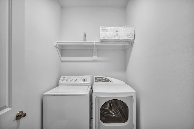 laundry area with washing machine and dryer