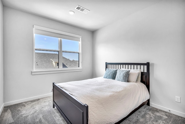 bedroom with dark carpet