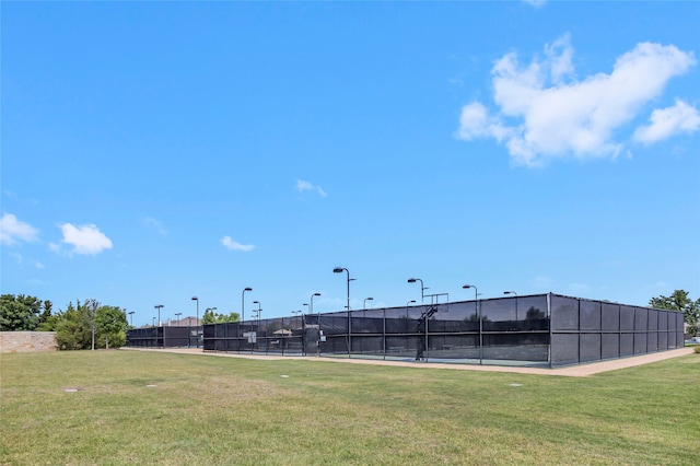 view of yard featuring tennis court