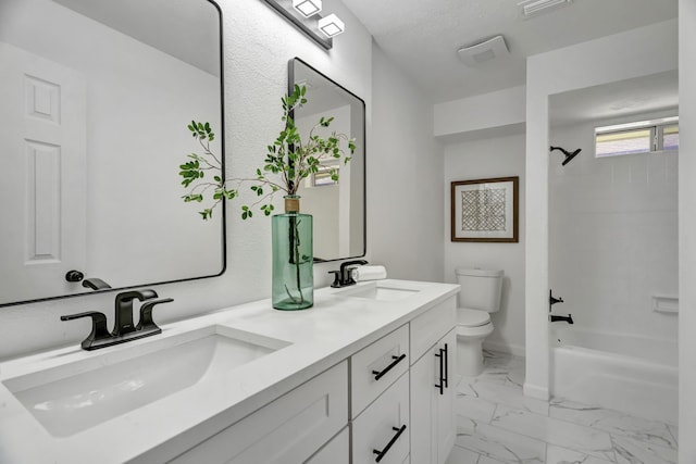 full bathroom with tiled shower / bath combo, toilet, a textured ceiling, and vanity