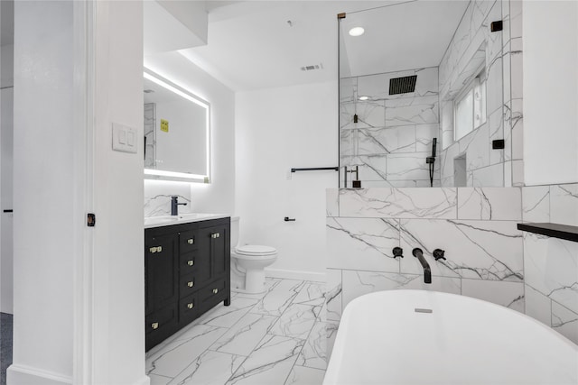 full bathroom featuring toilet, vanity, separate shower and tub, and tile walls