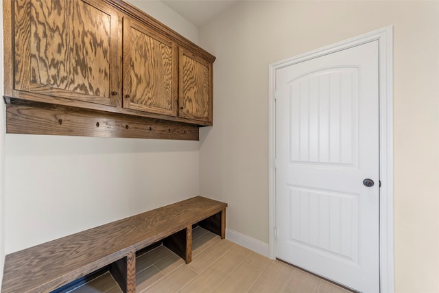 mudroom with light hardwood / wood-style flooring