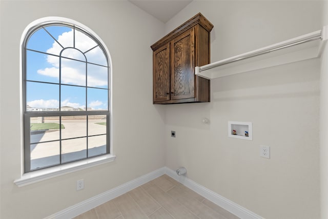 laundry area featuring cabinets, washer hookup, gas dryer hookup, and electric dryer hookup