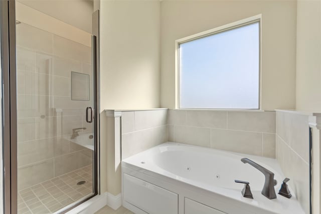 bathroom with separate shower and tub