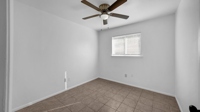 tiled empty room with ceiling fan