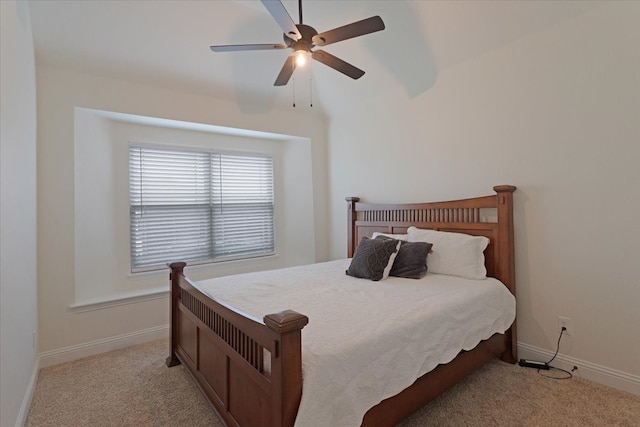 bedroom with ceiling fan and light colored carpet