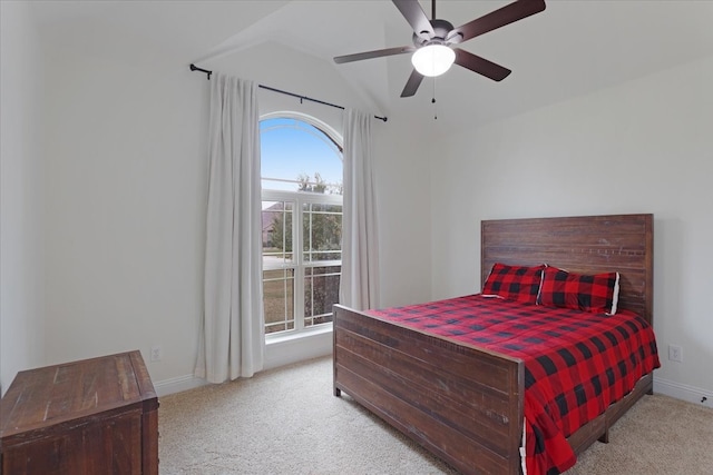 bedroom with ceiling fan, light colored carpet, and lofted ceiling