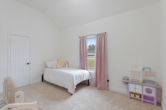 bedroom featuring carpet and vaulted ceiling