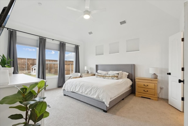 carpeted bedroom featuring vaulted ceiling and ceiling fan