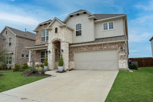 view of front of house featuring a garage and a front lawn