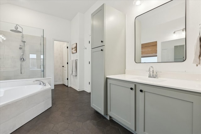 bathroom featuring vanity, tile patterned flooring, and plus walk in shower