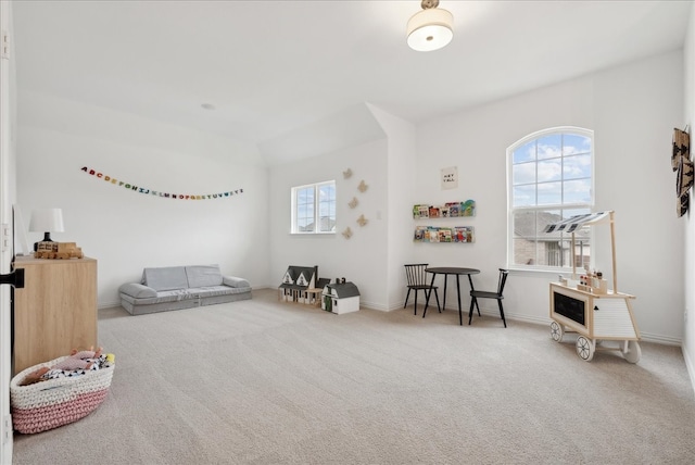 sitting room featuring carpet floors and a wealth of natural light