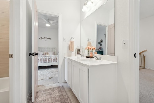 bathroom with ceiling fan and vanity