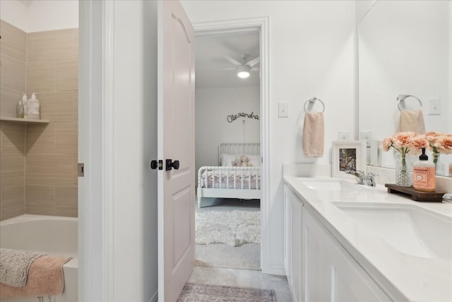 bathroom featuring ceiling fan and vanity