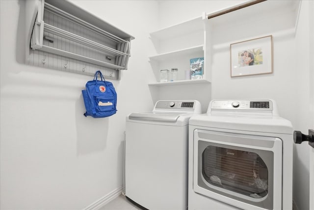 laundry area with independent washer and dryer