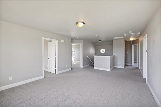 spare room with light colored carpet