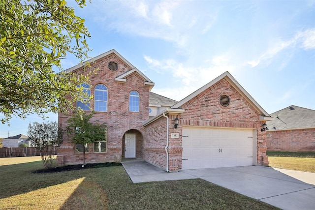 view of front property with a front yard and a garage