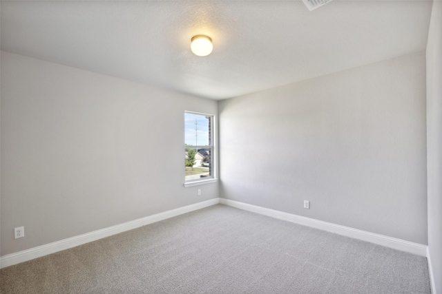 spare room with carpet flooring