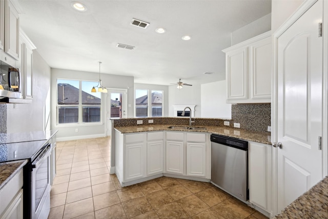 kitchen with white cabinetry, sink, stainless steel appliances, and plenty of natural light