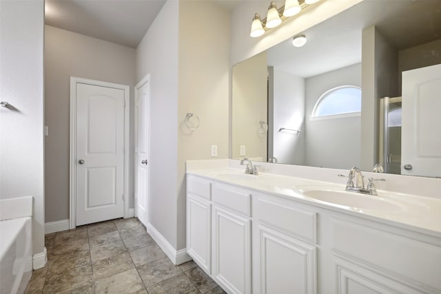 bathroom with vanity and a bathing tub