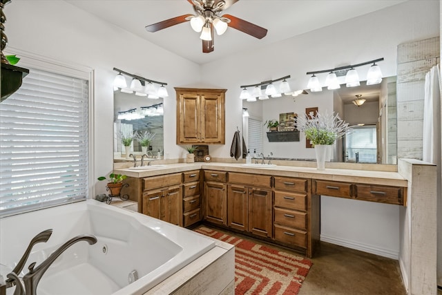 bathroom with vanity, ceiling fan, and tiled tub