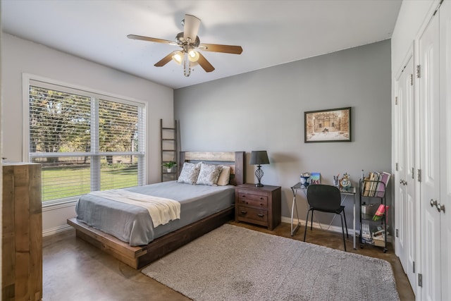 bedroom featuring ceiling fan and a closet